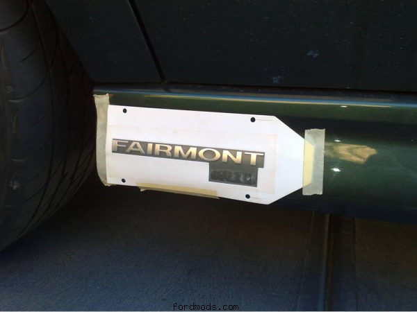 Fitting badge onto side skirt