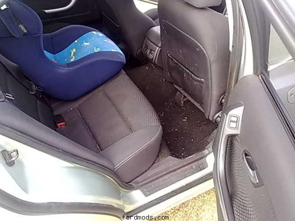 back seat.  damn grubby.