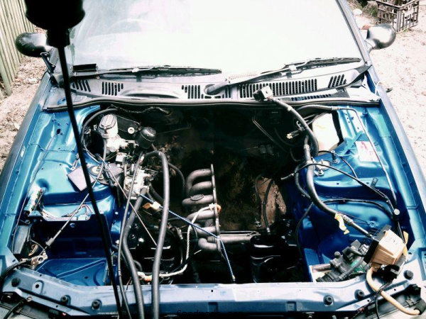 Newly painted engine bay in Shockwave blue.